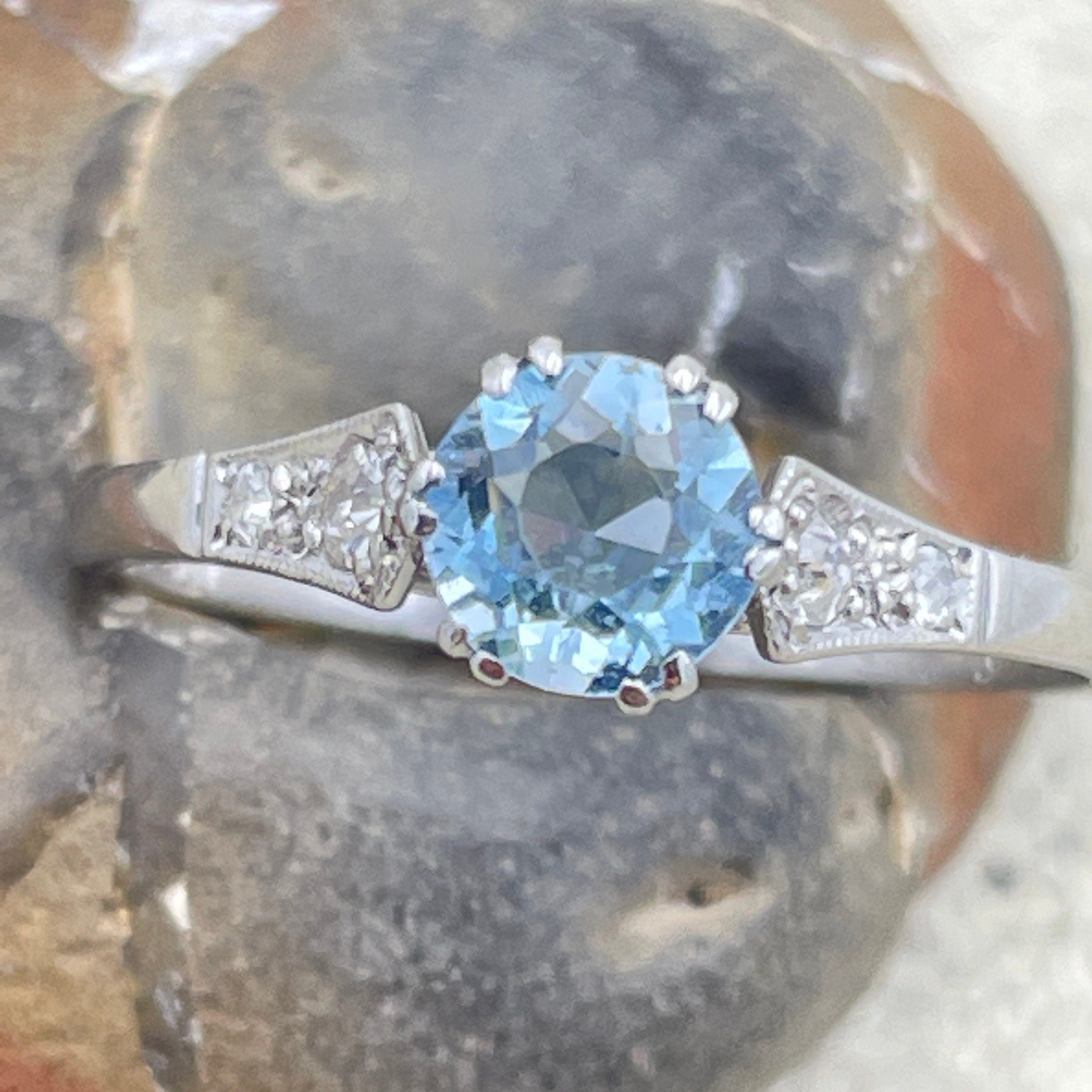 C1920s Art Deco, Platinum, Aquamarine Solitaire ring, with diamond set shoulders