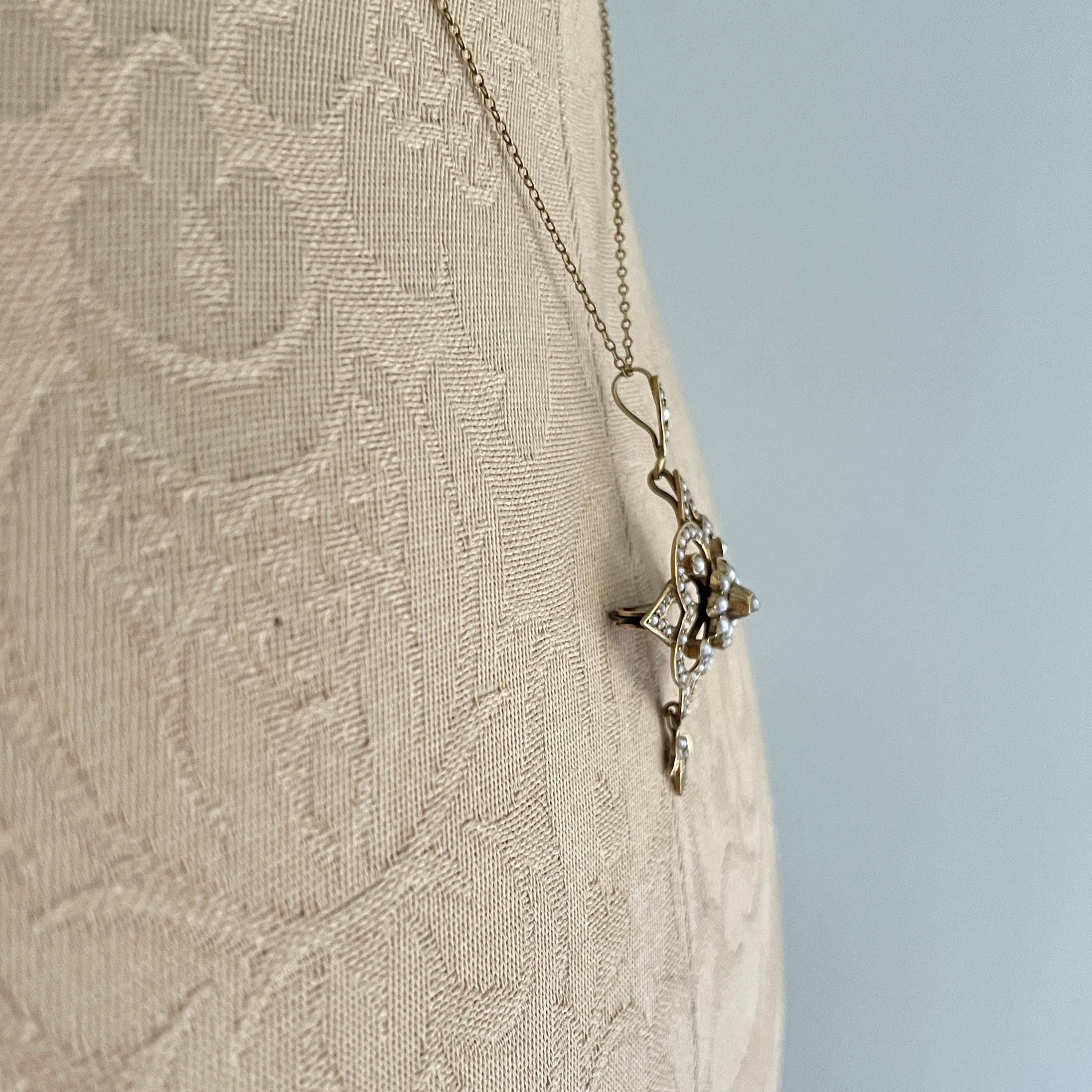 Edwardian 9ct gold seed pearl pendant on chain