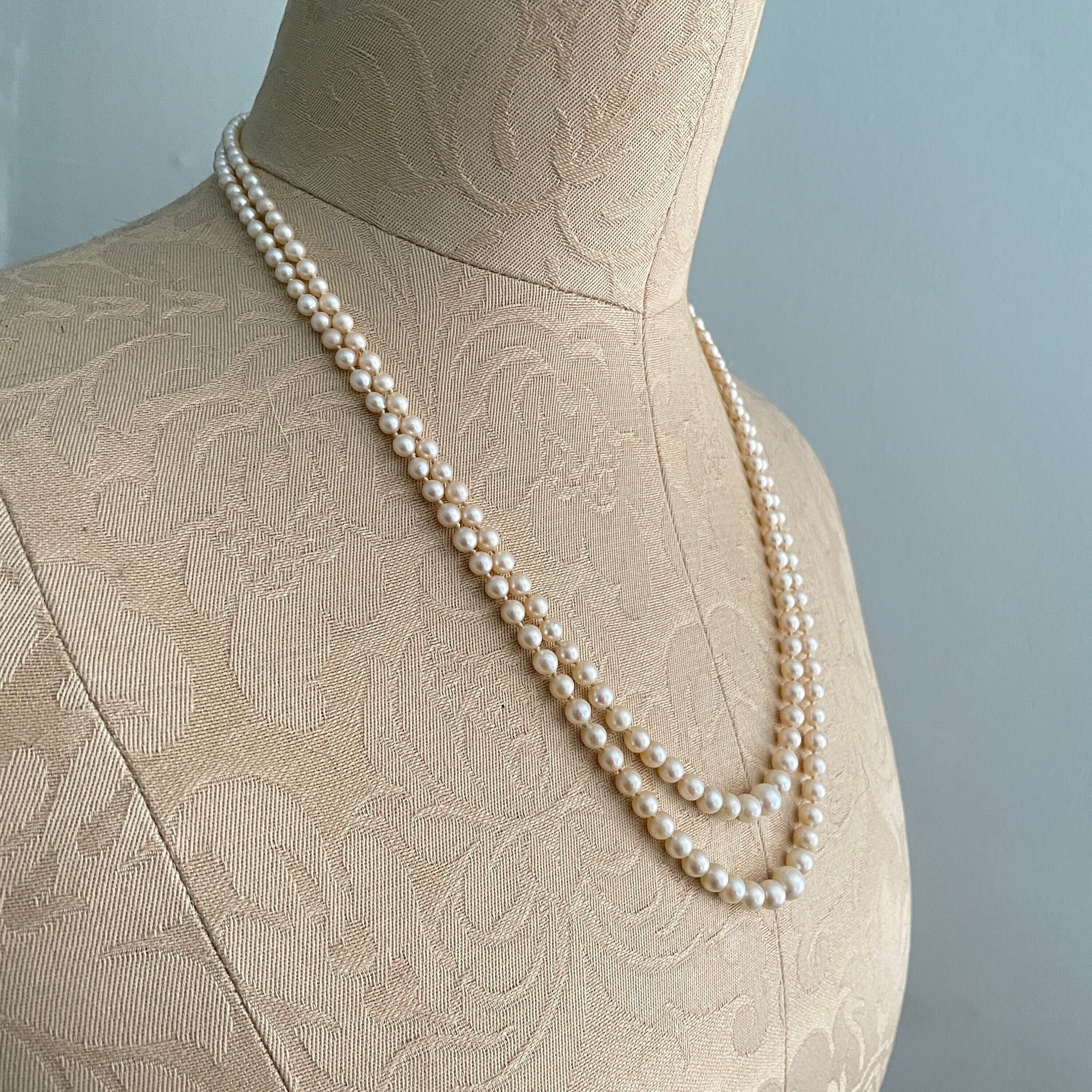 Art deco,  long cultured pearls necklace, double strand with 9ct gold clasp, diamond chip